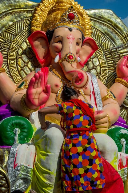 Artist making a statue and gives finishing touches on an idol of the Hindu god Lord Ganesha at an artist39s workshop for Ganesha festival