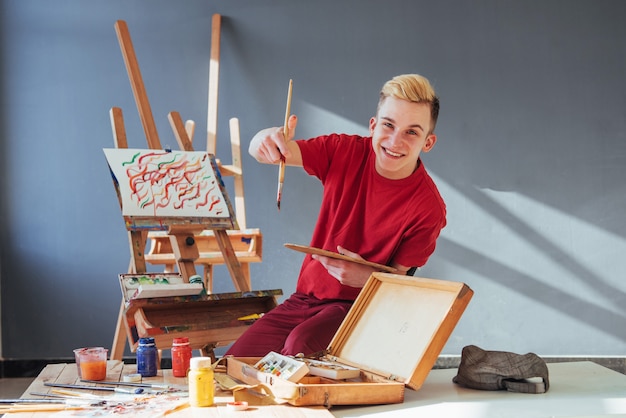 Artist painting a picture in a studio