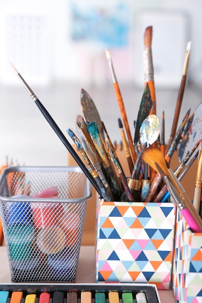 Photo artist's tools with paints on table