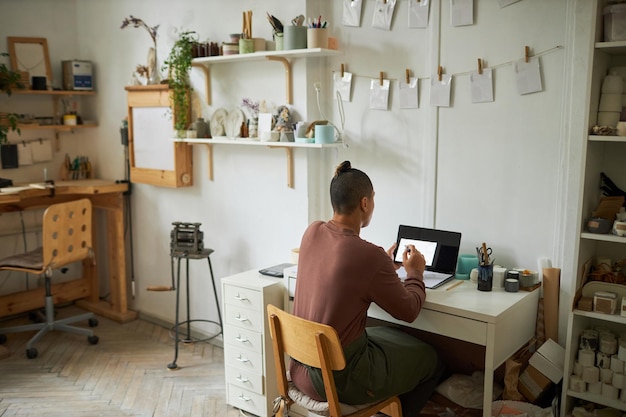 Artist working in cozy studio