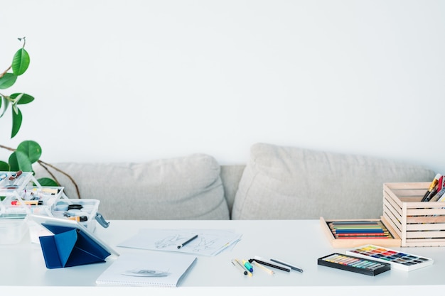 artist workplace. painter tools. watercolor palette, colored pencil set, paint organizer 