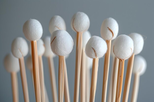 Photo artistic arrangement of cotton swabs with white tips on wooden sticks