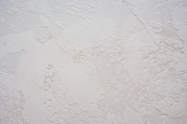 Artistic plaster on a gray and white wall