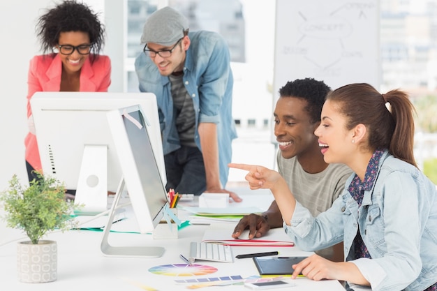 Artists working at desk in creative office