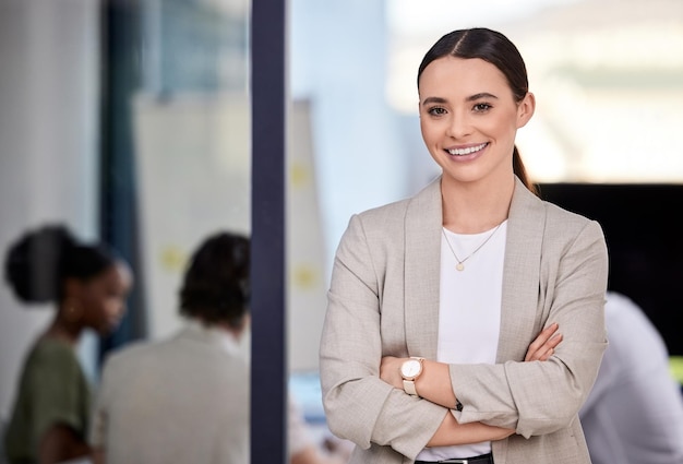 As soon as you trust yourself you will know how to live Shot of a businesswoman smiling at a business meeting in a modern office