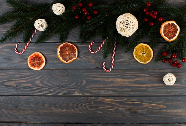 Ashberry branches, candy canes, dried fruit and other christmas tree decorations