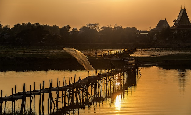 Asia Fishermen on bridge fishing at lake