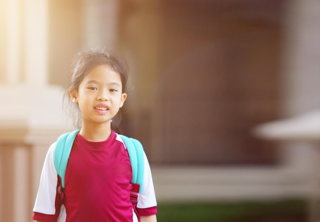 Asia girl child with backpack smile for back to school concept