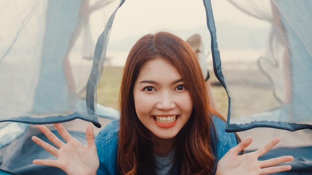 Asia teenagers girl influencer record footage introduce and camp place to her follower enjoy with happy moments in campsite