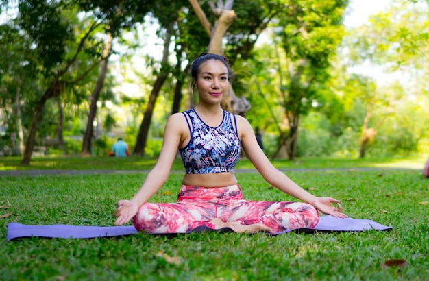 Asia Woman doing Yoga Pose at outdoor, Yoga Practice Training Concept