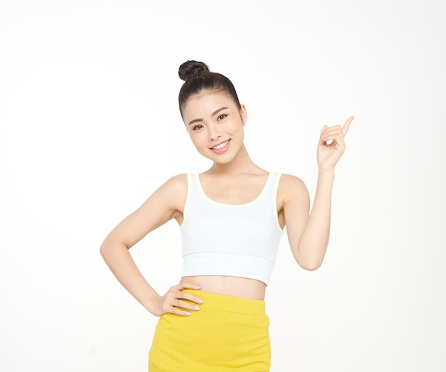 Asian attractive beautiful young woman with hand gesture and cute face expression in sporty outfit isolated on white background