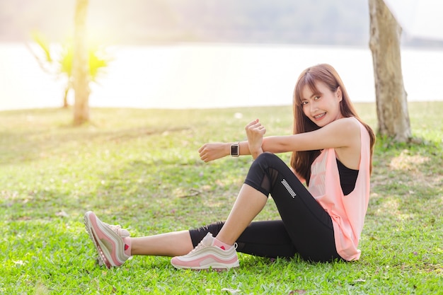 Asian beautiful young woman relaxing excercise in park