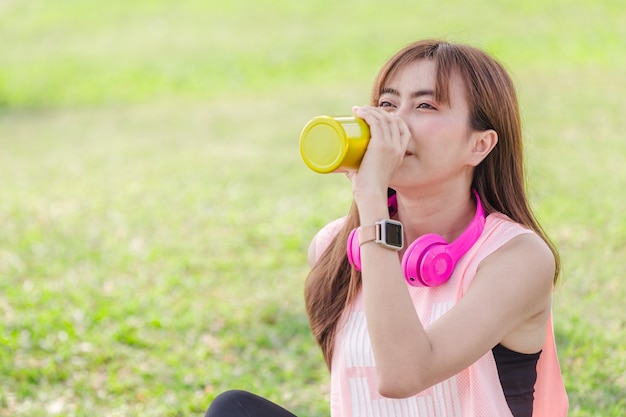 Asian beautiful young woman relaxing excercise in park