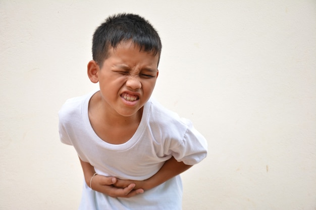 Asian boy stomach ache from stomach disease