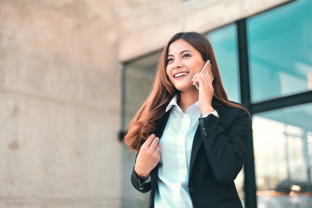 Asian business girl with smart phone