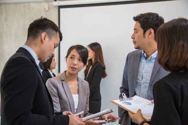 Asian business people meeting and working together for teamwork in office conference room.