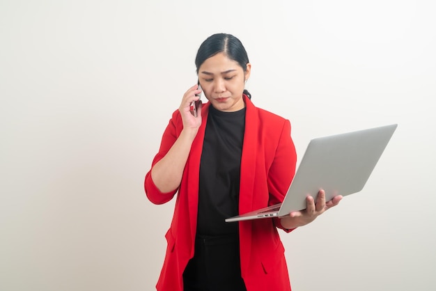 Asian business woman talking telephone with hand holding laptop on white background