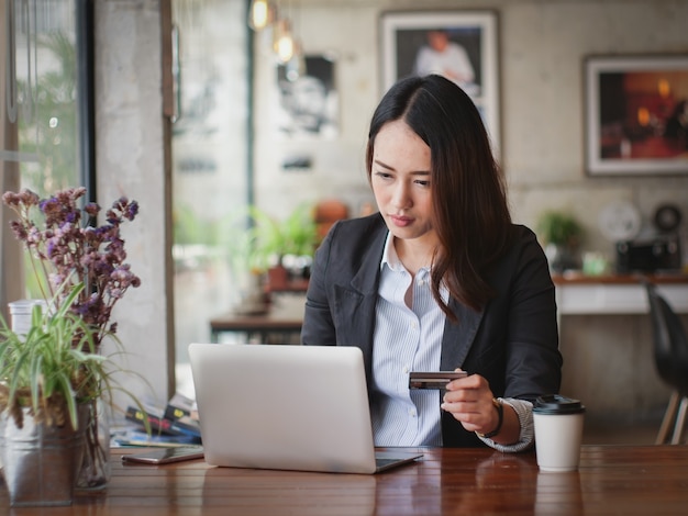 Asian business woman with laptop happy and smile concept success work 