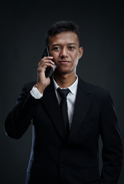 Asian Businessman Calling with smartphone