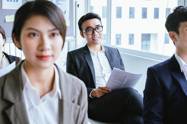 Asian businessman listening attentively during the meeting