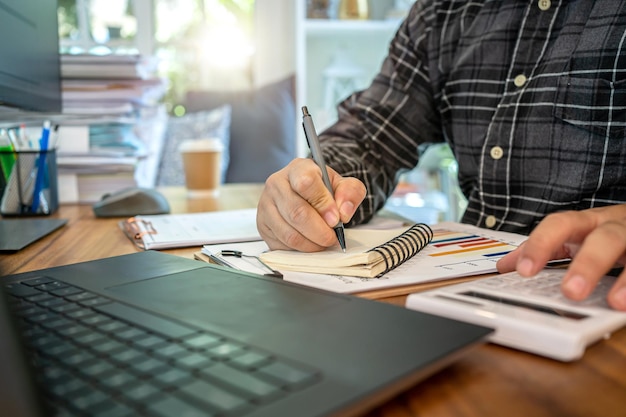 Asian businessman online working at home with a lot of document at home. Busy and exhausted.