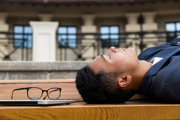 Asian businessman sleeping