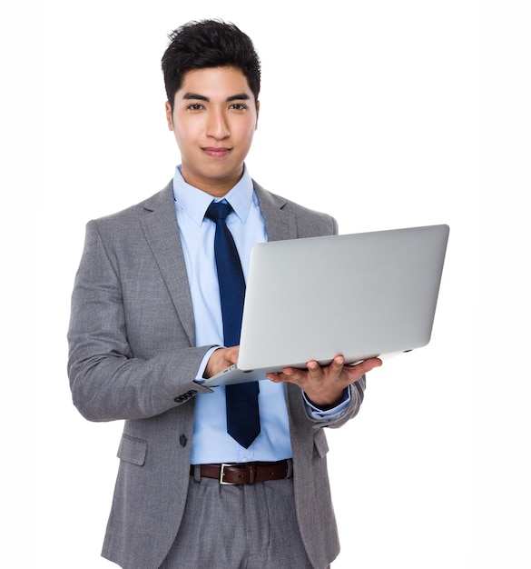 Asian businessman use of the notebook computer