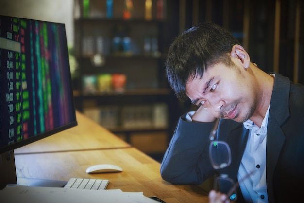 Asian businessman with back pain an office 