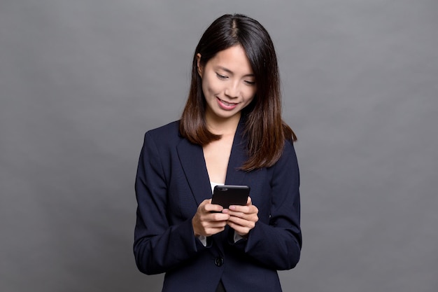 Asian businesswoman using cellphone