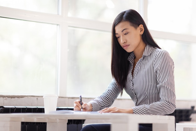 Asian Businesswoman Wrapped up in Work