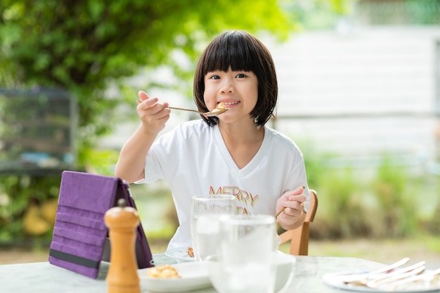 Asian children enjoy eating food