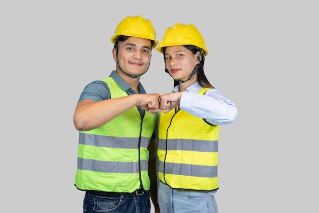 Asian Couple Engineer and Architect giving gestures and expressions on construction field