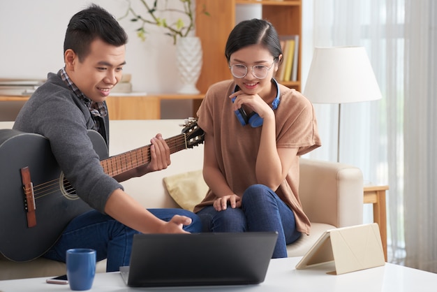 Asian couple writing new song