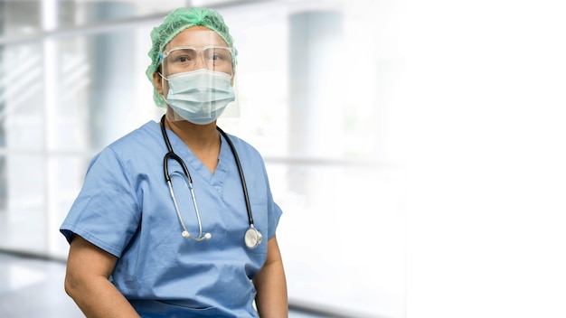 Asian doctor wearing face shield and PPE suit new normal to check patient protect safety infection Covid19 Coronavirus outbreak at quarantine nursing hospital ward