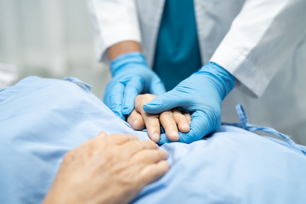 Asian doctor wearing glove protect Covid-19 Coronavirus.