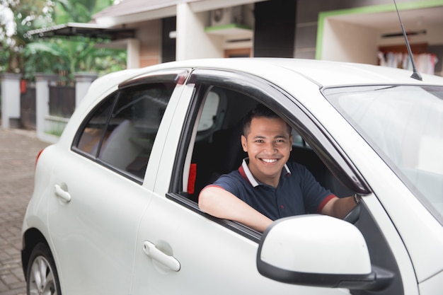 Asian driver smiling