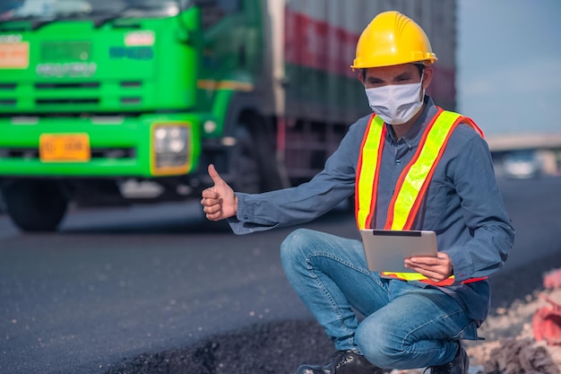 Asian Engineer construction are worker employee working by safety control helmet on site building