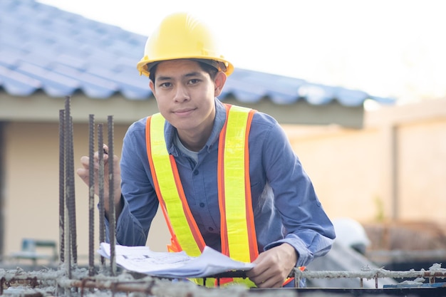 Asian Engineer construction are worker employee working by safety control helmet on site building