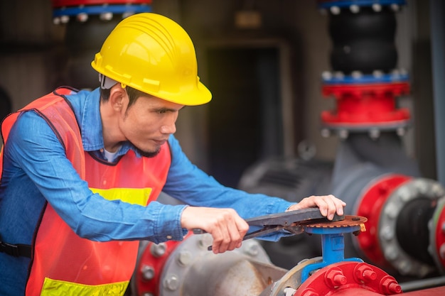 Asian engineer Indonesian employee worker working metal heavy factory plant