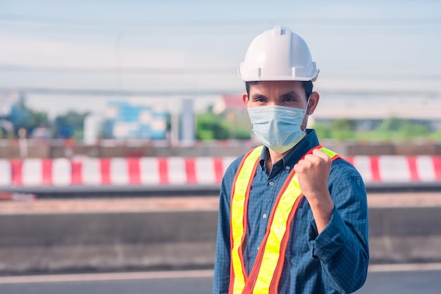 Asian Engineer standing outdoor on site construction posting confident Engineer construction happy j