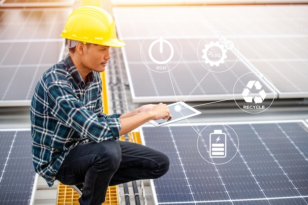 Asian Engineer use tablet Checking Solar power Energy in factory