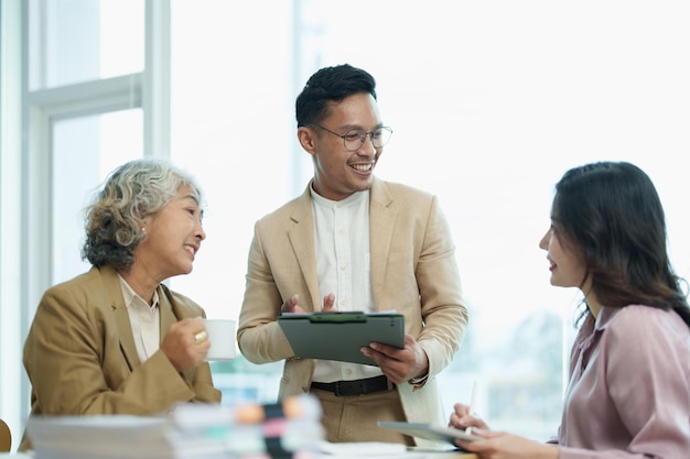 Asian entrepreneurs and business people meeting in a conference room in business planning financial budget and investment risk assessment to analyze customer groups to increase company growth