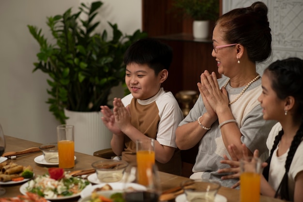 Asian family eating together