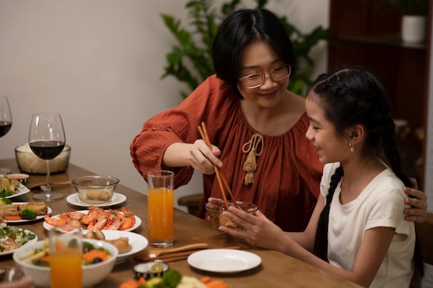 Asian family eating together