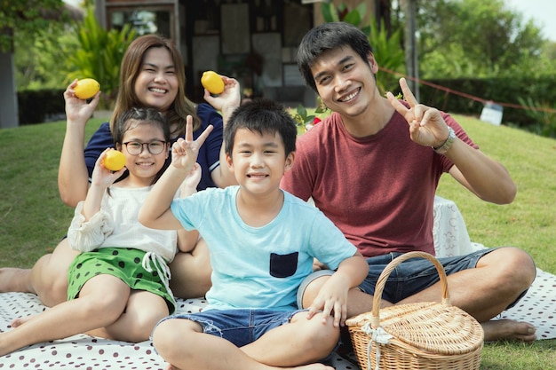 Asian family happiness and relax at home garden