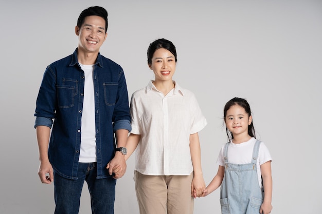 Asian family portrait posing on white background