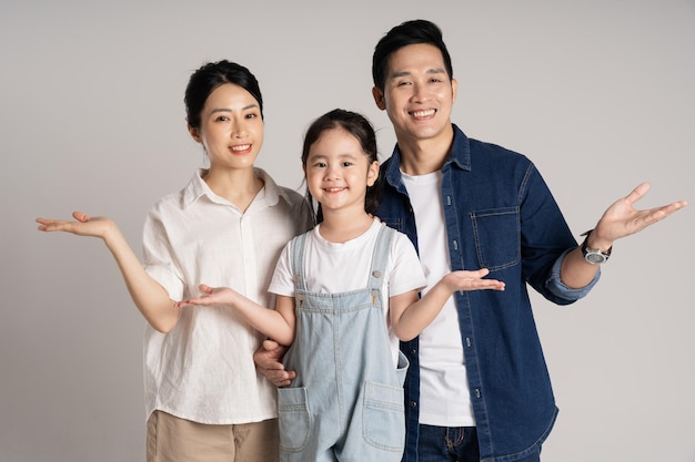 Asian family portrait posing on white background