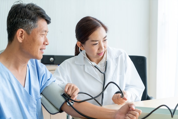 Asian female doctor ckecking her patient