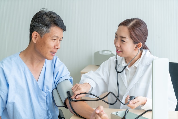 Asian female doctor ckecking her patient 