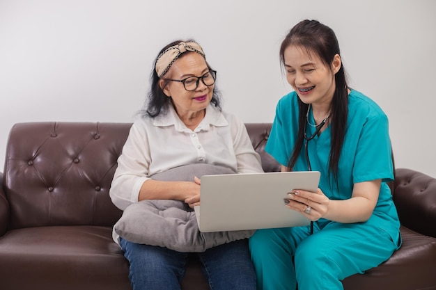 Asian female doctor explaining to educate medical Information about life planning with senior patient